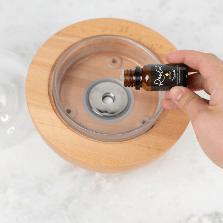 Glass Fountain diffuser shown as bundle option with essential oil kits by Rooted For Good