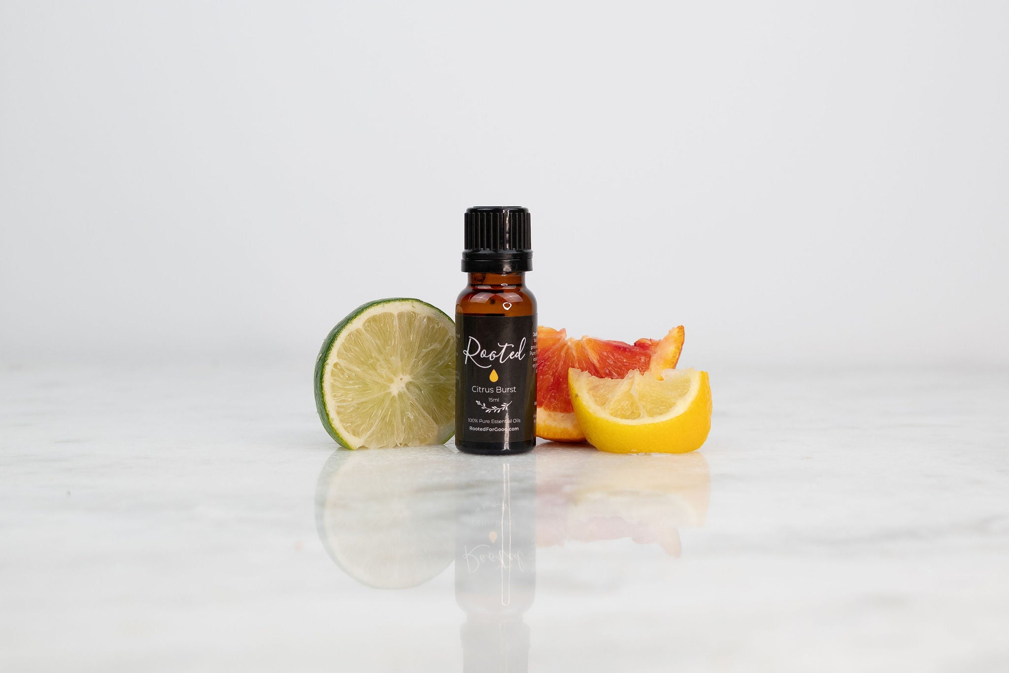 Bottle of essential oil with menstrual relief herbs and a diffuser.